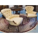 ARMCHAIRS, a pair, Victorian walnut, circa 1860, in pale buttoned yellow fabric, on ceramic castors,