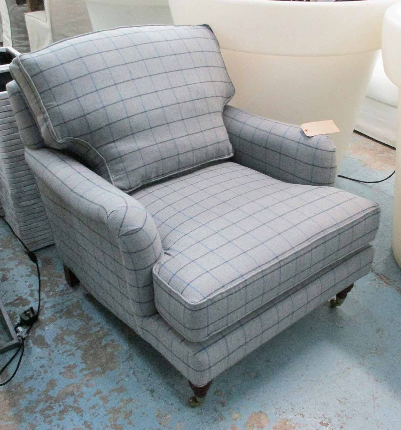 ARMCHAIR, Howard style in a grey patterned fabric on turned castor supports, 90cm x 100cm x 90cm.