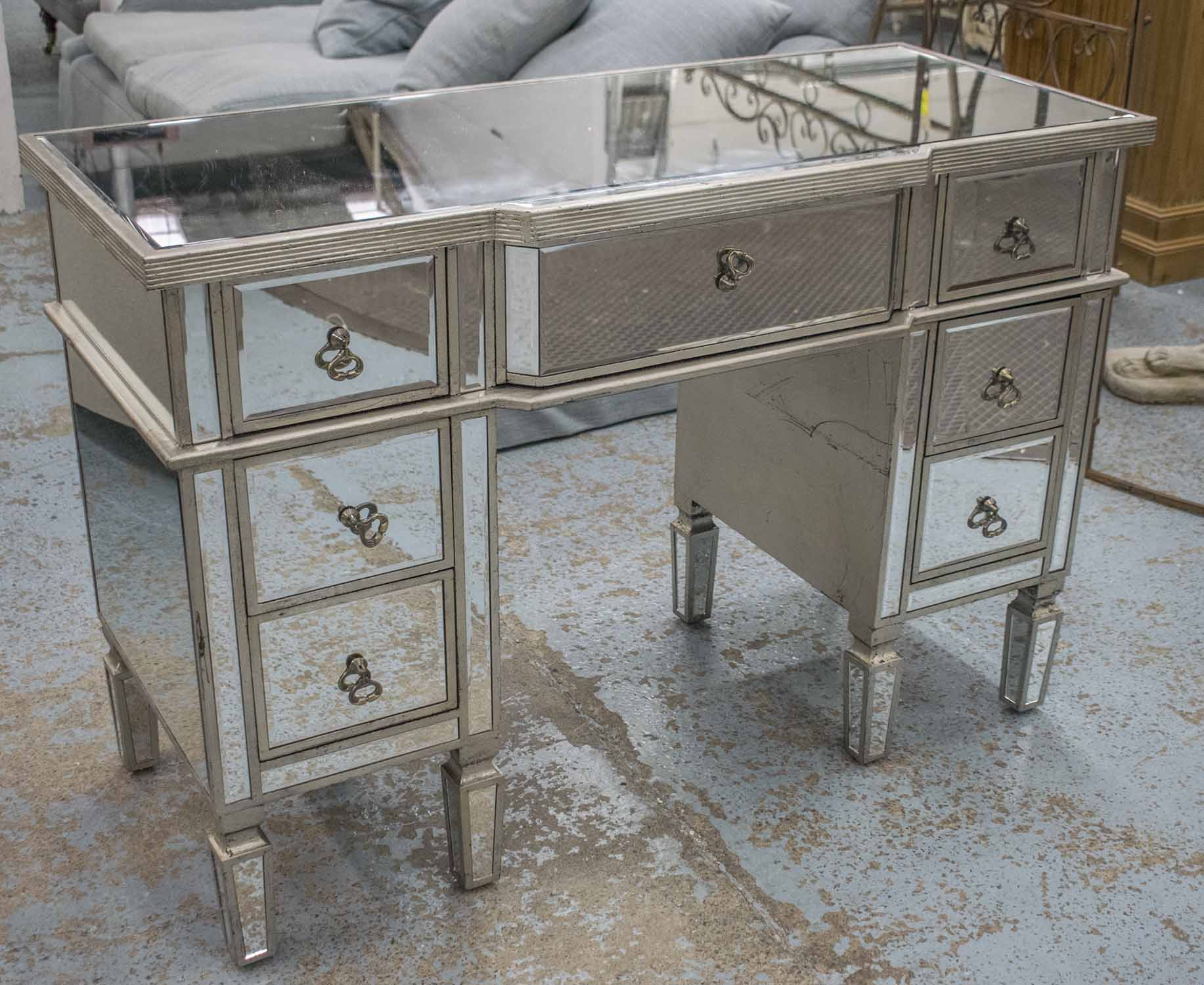 DRESSING TABLE, silvered wood and mirrored with seven drawers, 82cm H x 121cm x 52cm.