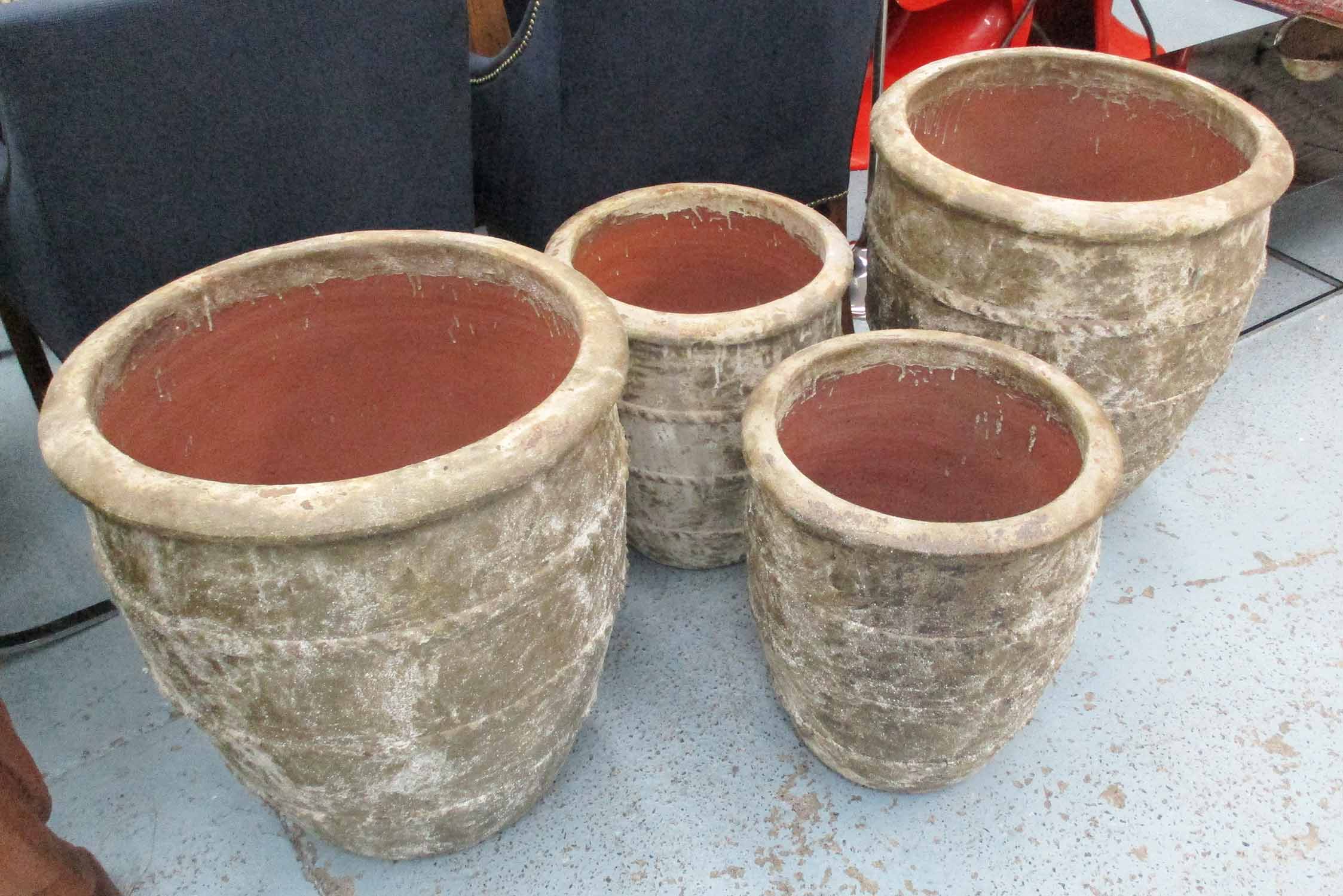 RUSTIC PLANTERS, two pairs, in terracotta, large 60cm H x 56cm W.