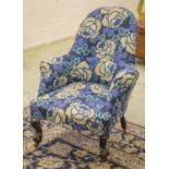 ARMCHAIR, Victorian, upholstered in blue floral patterned fabric, 64cm W.