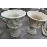 URNS, a pair, with floral swags, in reconstituted stone, 56cm H.