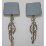 PAIR OF CAST METAL WALL LIGHTS, formed from balustrades and shades, 112cm H.
