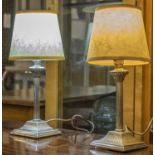 TABLE LAMPS, a pair, mid 20th century, silvered metal with reeded column and stepped square base,