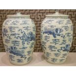 CHINESE BLUE AND WHITE JARS, a pair, vase form with lids in blue and white chinoiserie decoration,
