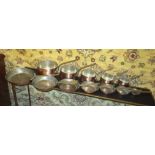 GRADUATED COPPER PANS, a set of five,