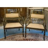 OPEN ARMCHAIRS, a pair, Regency style ebonised and gilt,