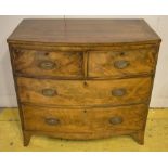 BOWFRONT CHEST, Regency mahogany with crossbanded top above two short and two long drawers,