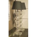 TABLE LAMPS, a pair, perspex and chrome with ball columns, black shades and glass bases, 57cm H.