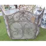 FIRE SCREEN, in distressed effect metal, folding with three panels, 83cm H.