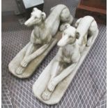RECUMBANT GREYHOUNDS, a pair, in reconstituted stone, 82cm L.