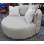 ROUND SOFA, in a beige fabric, external buttoned back, on an ebonised swivel support, 135cm diam.