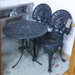 GARDEN SET, of table and a pair of chairs in painted cast iron, 60cm diam x 62cm H.