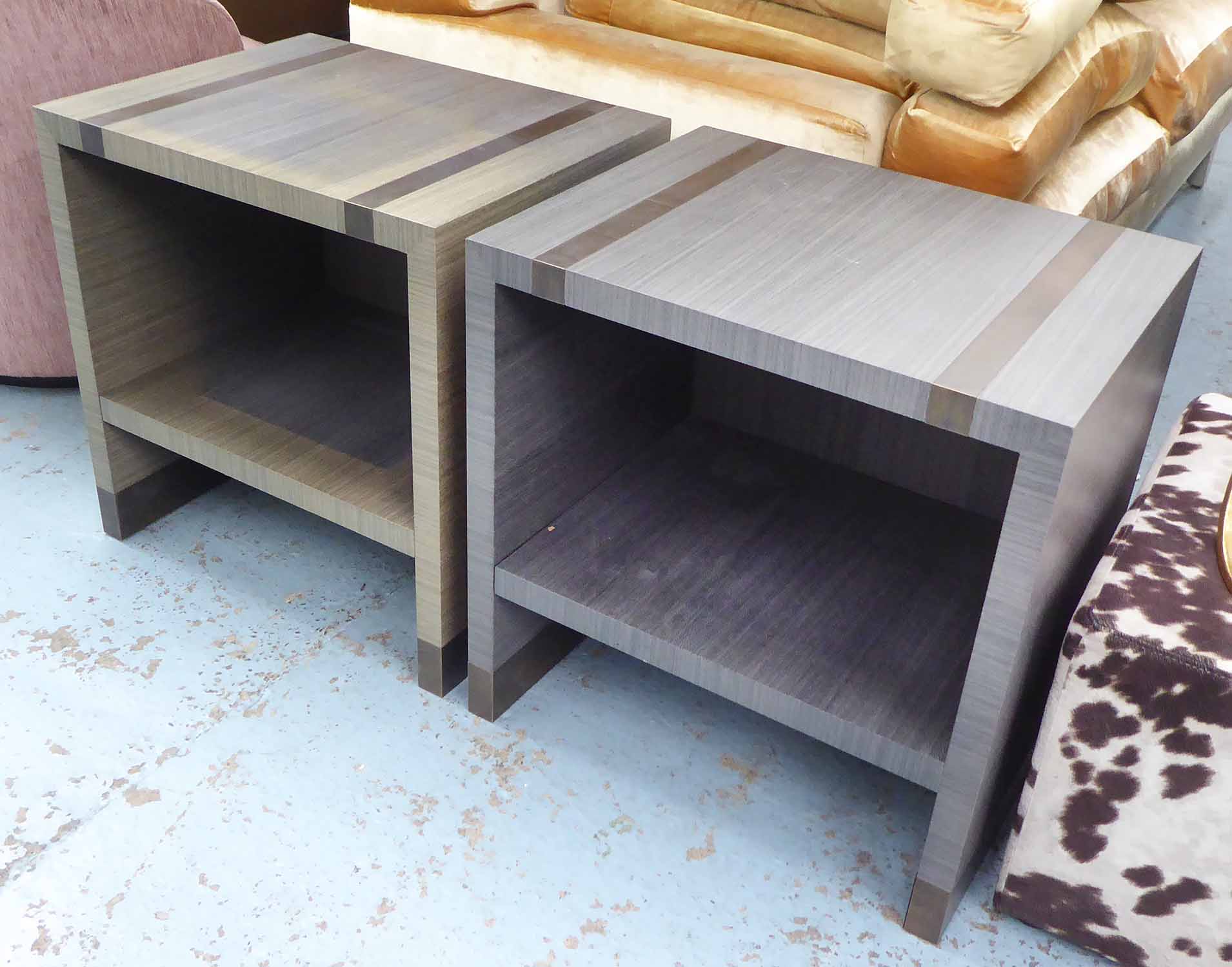 SIDE TABLES, a pair, contemporary style in grey with bronzed insets to tops, 60cm x 45cm x 60cm H.