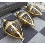 HANGING LANTERNS, three, ovid form brass and glass, each 90cm H.