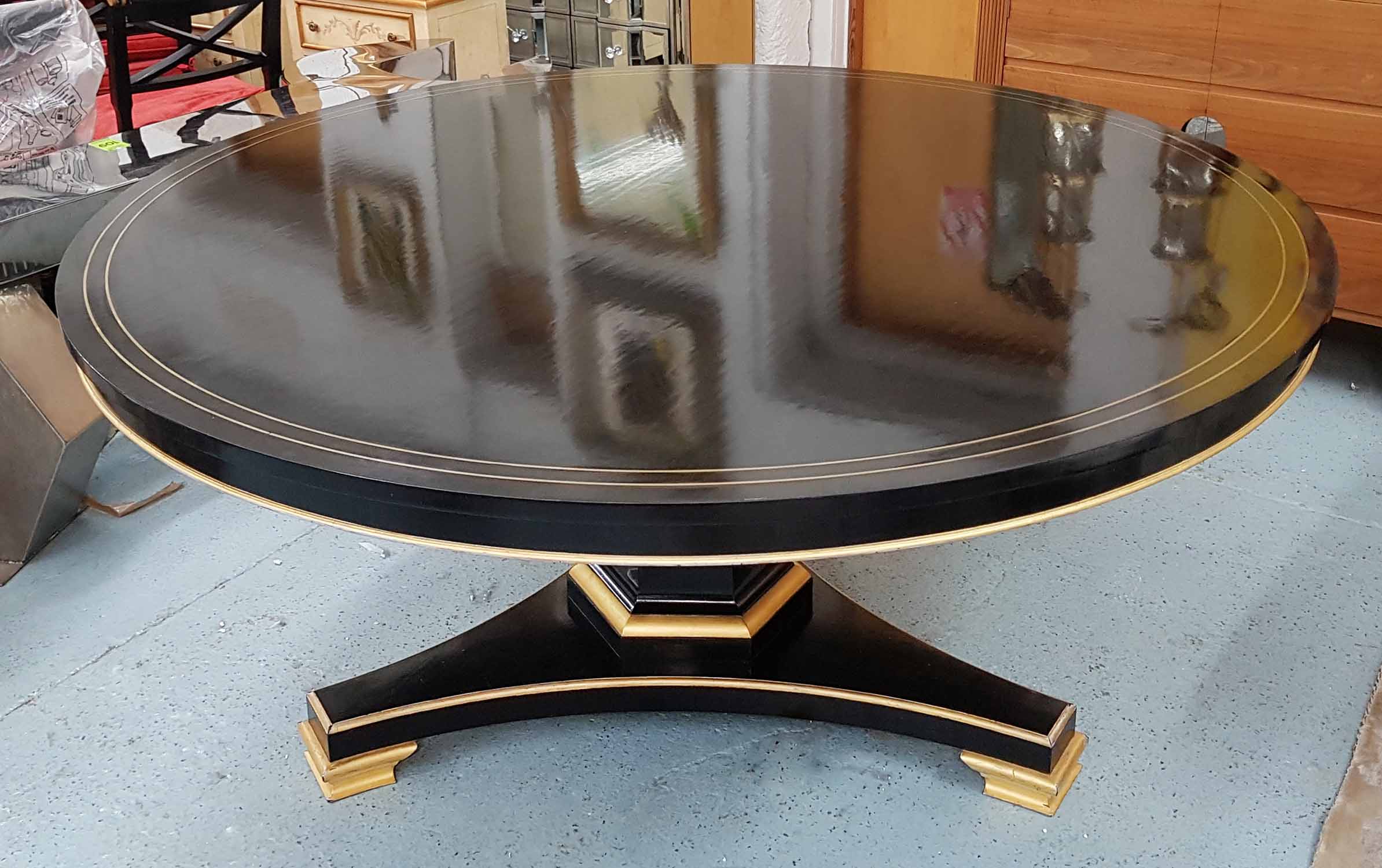 BREAKFAST TABLE, Regency style, ebonised with brass inlayed to top, gilt detail, 163 Diam.