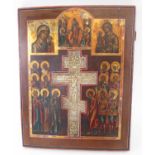 19TH CENTURY RUSSIAN CRUCIFIXION ICON, the figurative painted wooden panel inset a brass crucifix,
