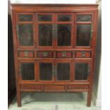 A LARGE CHINESE LACQUER AND WOOD CABINET, 19th century, with eight doors and four drawers,