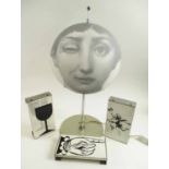 FORNASETTI TABLE LAMP, 56cm H; and 3 various Fornasetti door handles circa 1960's, each 21.5cm x 11.