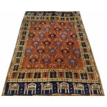 FINE UZBEK AFGHAN RUG, of all over design with comb border, 200cm x 140cm.