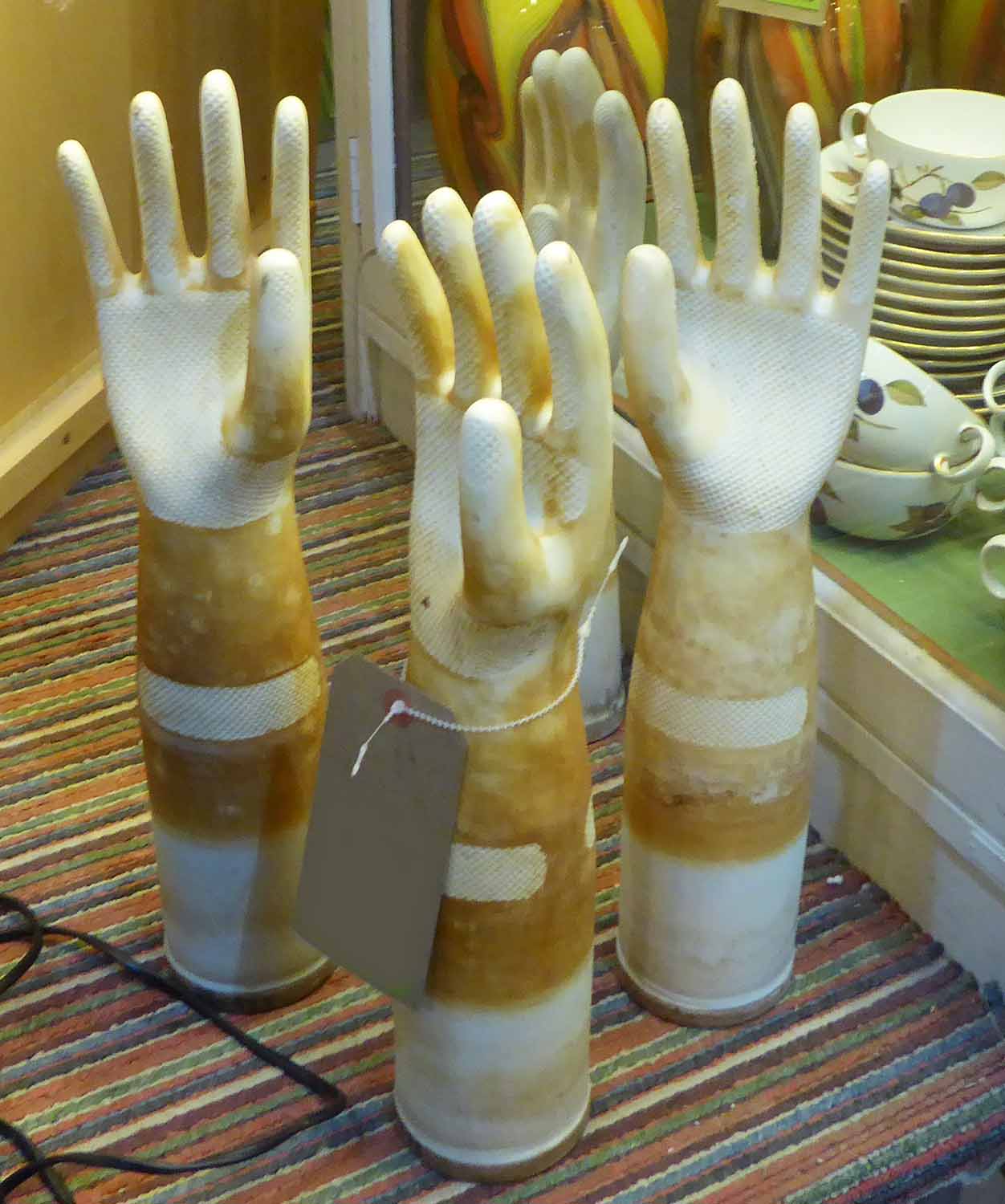 SPANISH FACTORY RUBBER GLOVE MOULD BLOCKS, a set of four, mid 20th century porcelain,