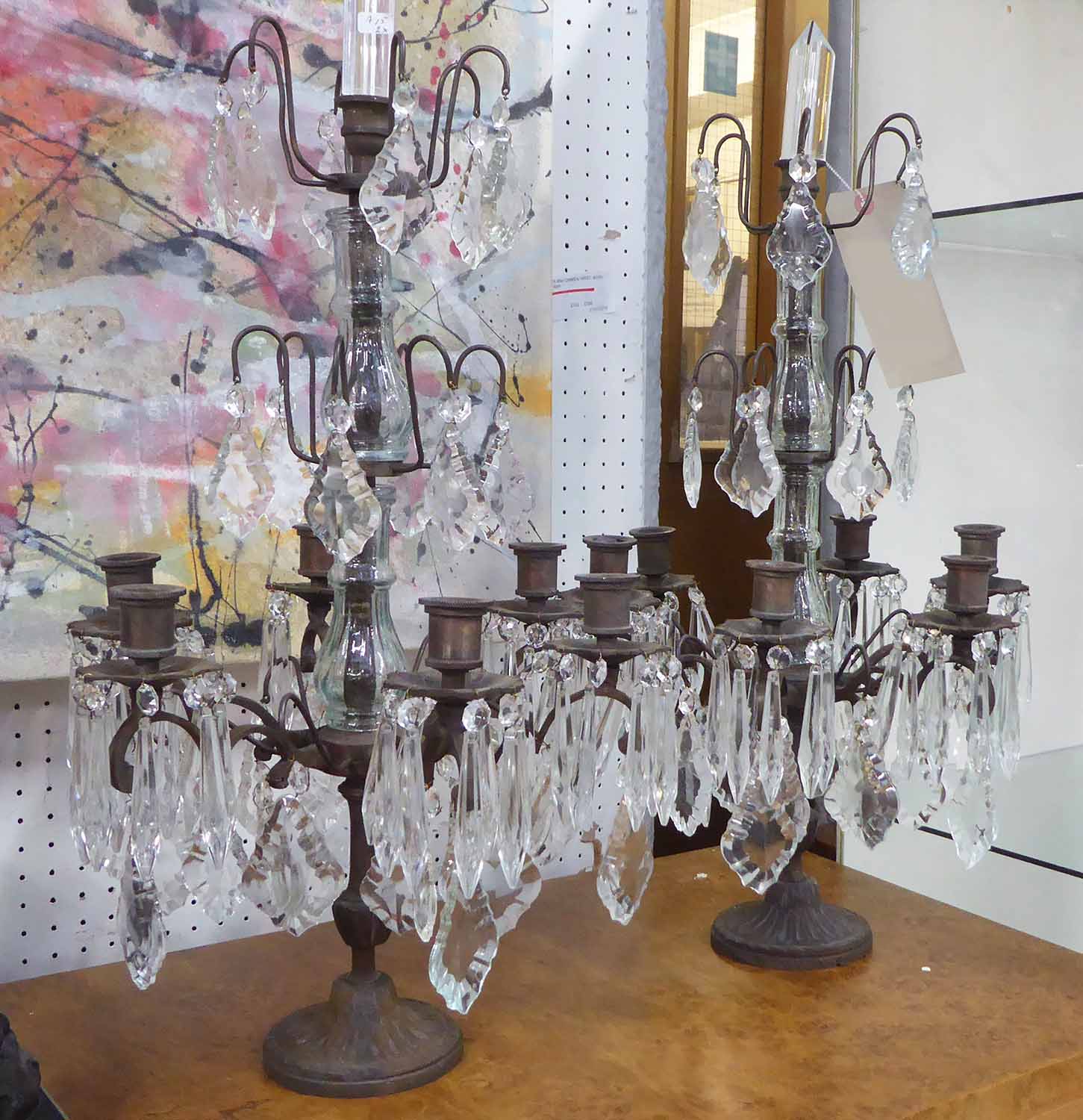 TABLE CANDELABRAS, a pair, six branch in rustic finish with glass drops, 60cm H.