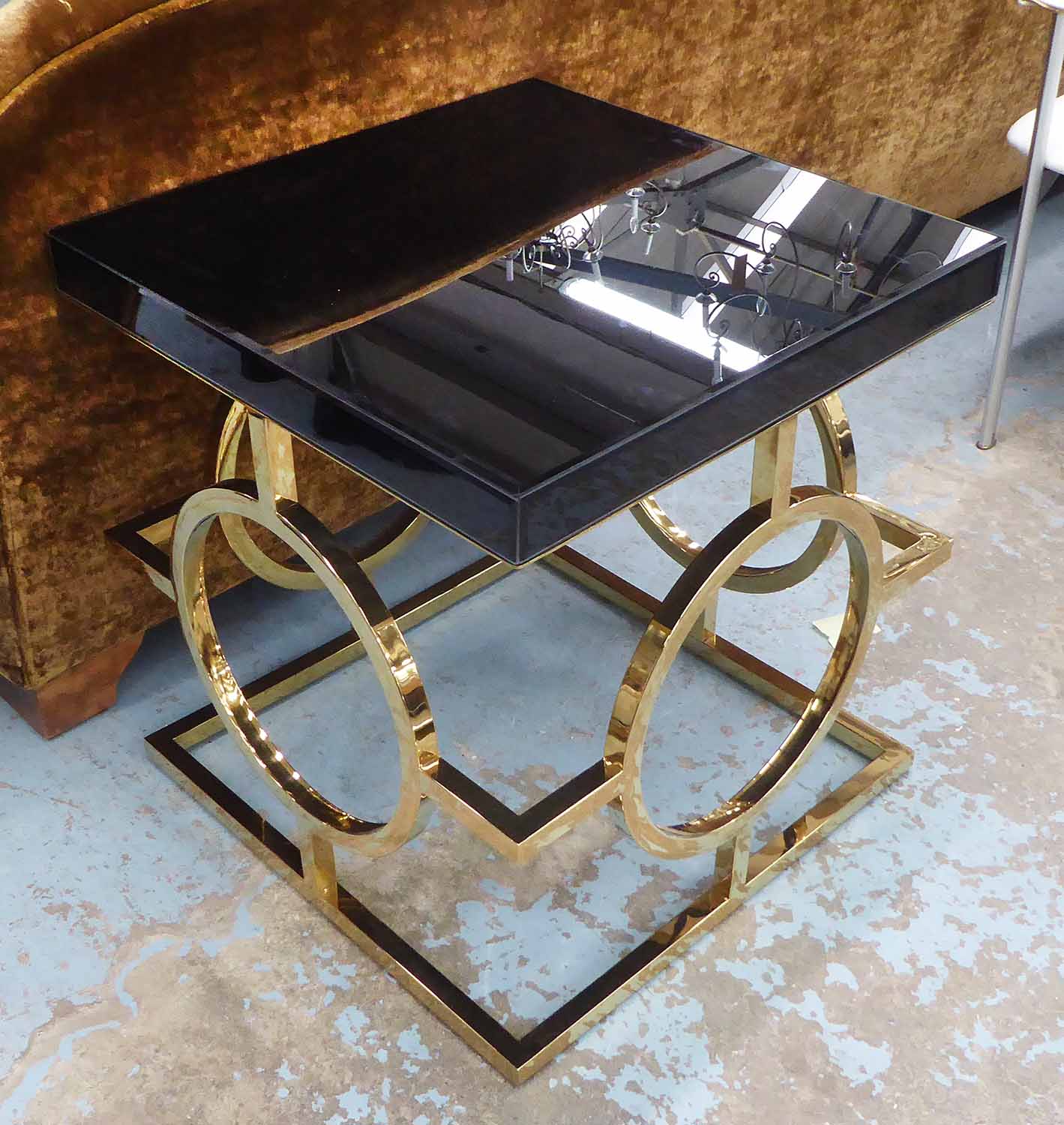 SIDE TABLE, black gloss top on brass coloured metal frame, 61cm W x 63cm D x 66cm H.