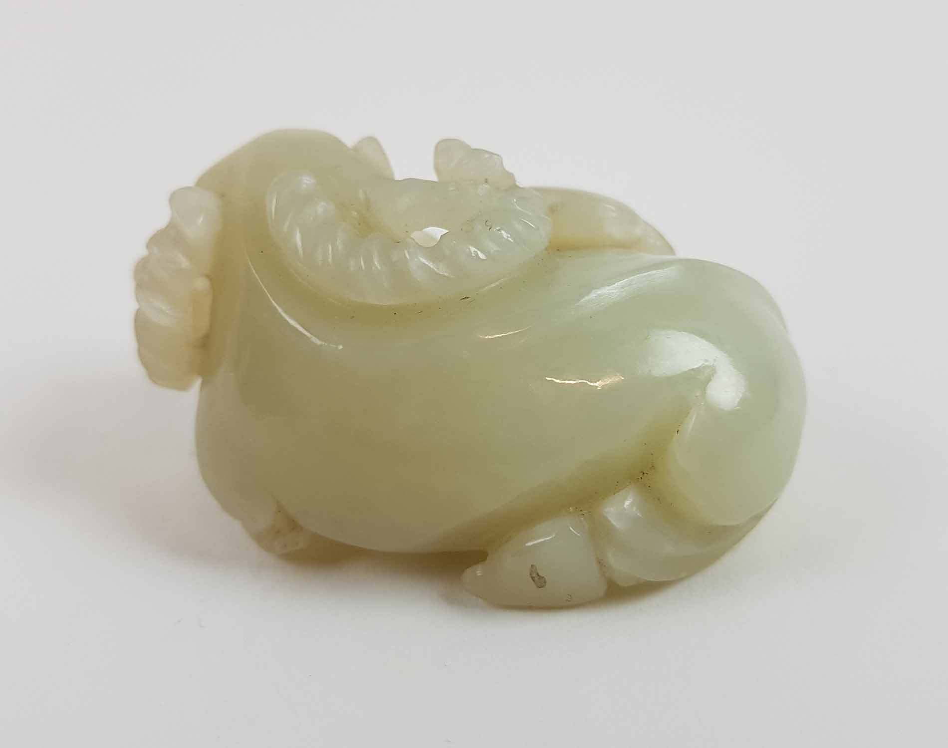 A CHINESE PALE CELADON COLOURED JADE FIGURE, of a recumbent ram, 6cm Long. - Image 4 of 4