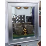 WALL MIRROR, with a silver gilt frame and bevelled plate, 154cm W x 126cm H.