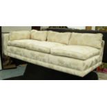 ANDREW MARTIN CHAISE LONGUE, in cream floral fabric on castors, 215cm L.