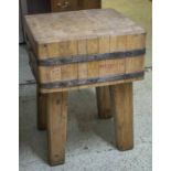 BUTCHERS BLOCK, beech end grain and metal bound on substantial square supports,