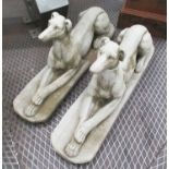 RECUMBENT GREYHOUNDS, a pair, in reconstituted stone, 82cm L.