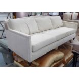 SOFA, three seater, in a cream flecked fabric on square supports, 220cm L.