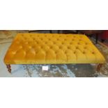 HEARTH STOOL, with buttoned gold velvet upholstery on short turned supports with castors,