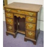 KNEEHOLE DESK, George II mahoghany with eight drawers around a recessed door,