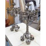 TABLE CANDELABRA, a pair, baronial gothic design, metal, each 61cm H x 32cm W.