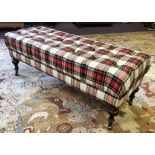 OTTOMAN, rectangular buttoned tartan upholstery on turned mahogany legs and brass castors,