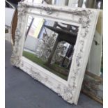 WALL MIRROR, cream painted with silvered detail, and bevelled plate, 94cm x 125cm.