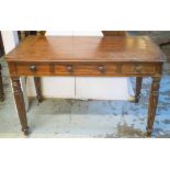 WRITING TABLE, George IV mahogany with three drawers on reeded legs, 74cm H x 118cm x 59cm.