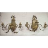 WALL LIGHTS, a pair, Art Deco sheet brass with triple sconces, adorned with petals, 53cm H x 55cm W.