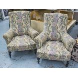 ARMCHAIRS, a pair, continental ebonised in floral patterned fabric, 85cm W.