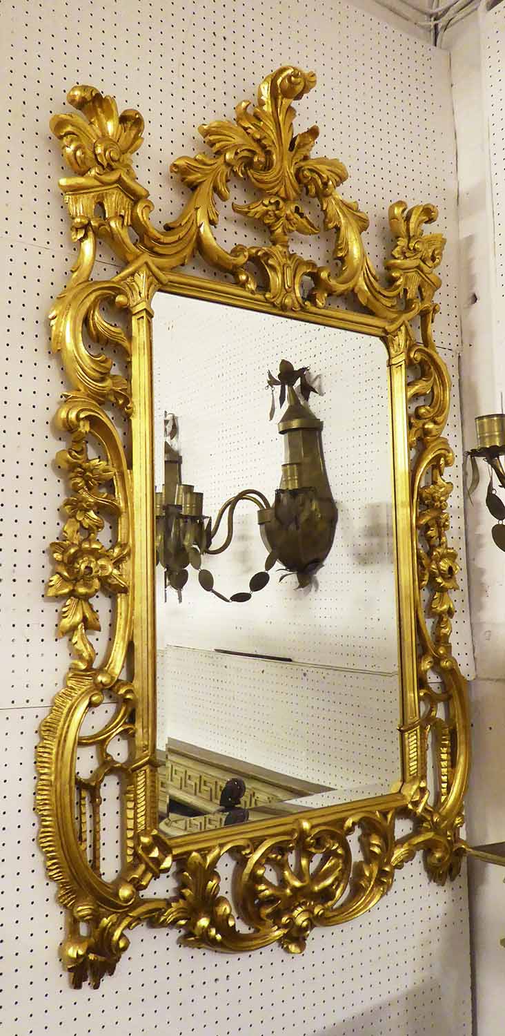 WALL MIRROR, Georgian style gilt with an elaborate frame enclosing a bevelled plate,