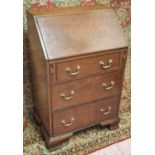 BUREAU, early 20th century, Georgian revival mahogany of small proportions with slope,