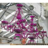 CHANDELIERS, a pair, purple glass, each with five lights, 80cm H x 54cm W.