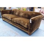 SOFA, of large proportions in chocolate brown velvet, 251cm W x 79cm H x 113cm D.