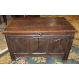 COFFER, late 17th century oak with a rectangular rising top and a panelled front, back and sides,