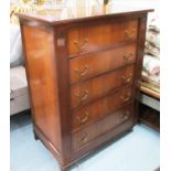 CHEST, of five drawers (oak lined) in a mahogany finish on turned front supports,