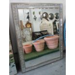 WALL MIRROR, Art Deco style, with an angled border and a rectangular bevelled plate,