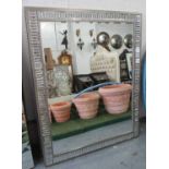 WALL MIRROR, Art Deco style, with an angled border and a rectangular bevelled plate,