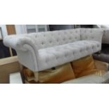 ANDREW MARTIN CHESTERFIELD SOFA, in buttoned natural coloured material, 225cm W x 100cm D.